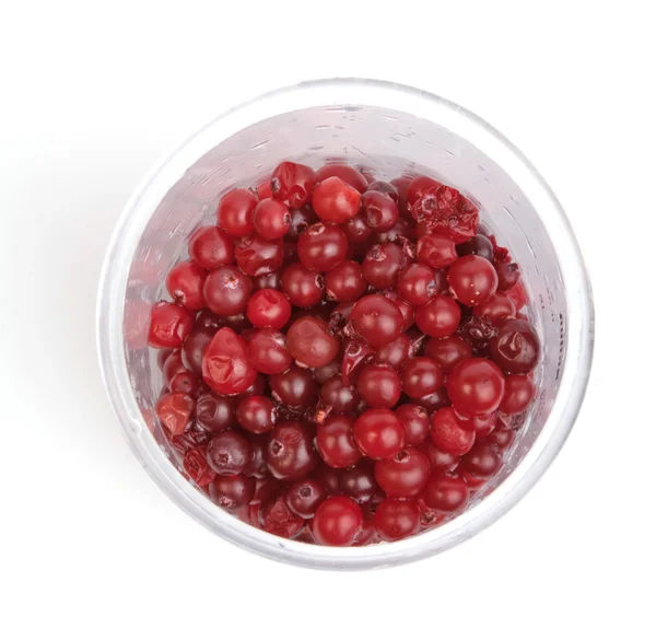 stock image Cranberries in plastic glass