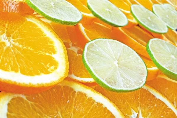 Oranje en kalk plakjes — Stockfoto