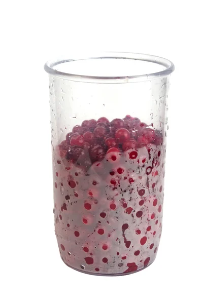 Plastglas med tranbär — Stockfoto