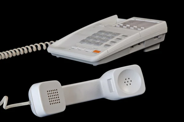 Белый телефон изолирован на черный — стоковое фото