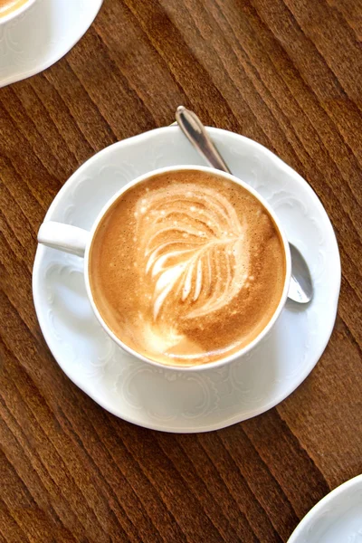 stock image Cup of coffee with leaf