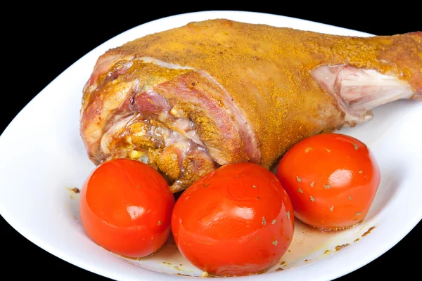 Roasted turkey leg with tomatoes — Stock Photo, Image