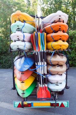 Trailer with kayaks and paddles clipart