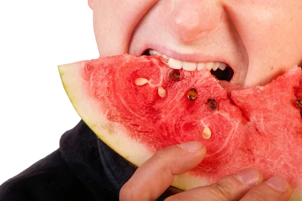 Člověk jíst meloun plátek — Stock fotografie
