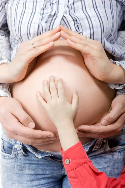 Pregnant belly with husband and child — Stock Photo, Image