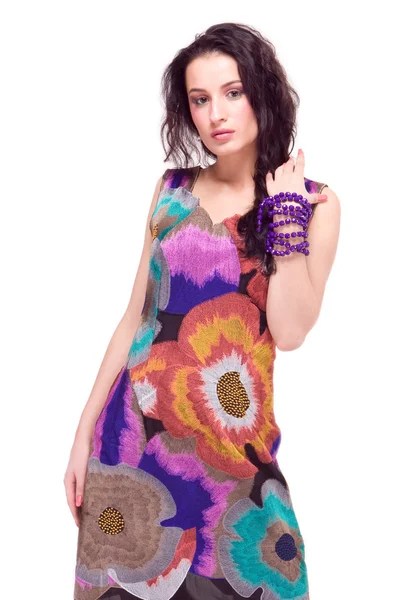Beautiful young model in colorful dress — Stock Photo, Image