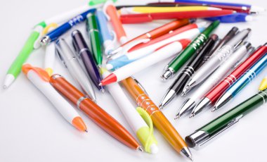 Set of colored pens on table clipart