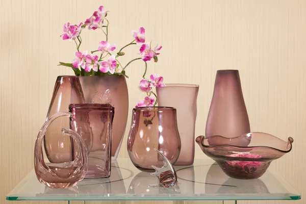 Set of vases on glass table — Stock Photo, Image