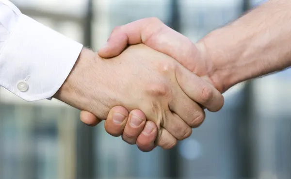 Handshake between office workers — Stock Photo, Image