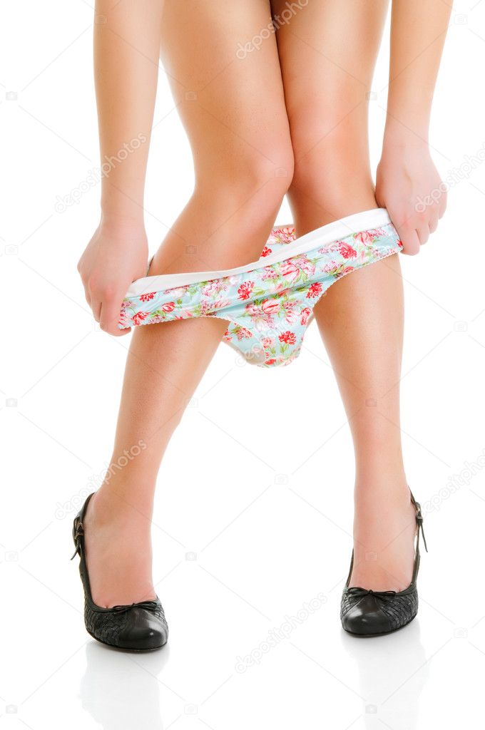 Woman taking off her panties Stock Photo