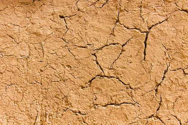 Gamla spruckna vägg av lera — Stockfoto