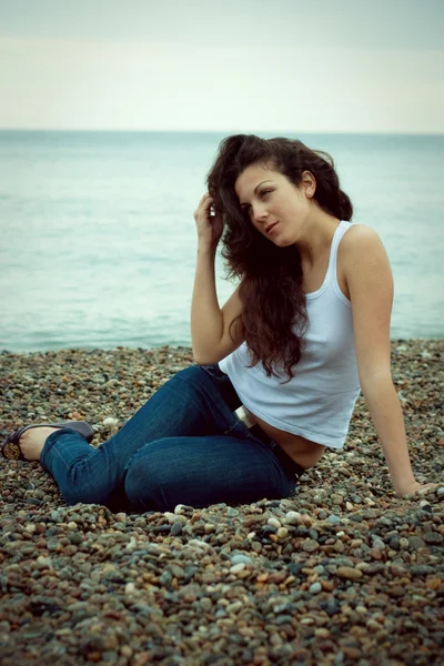 stock image Beautiful woman on the sea shore