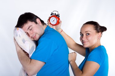 Man sleeping, woman want to wake up him clipart