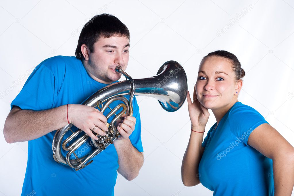 Woman is listening music of French horn