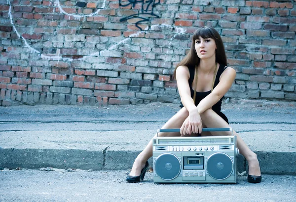 Woman with boom box on the street — Stock Photo, Image