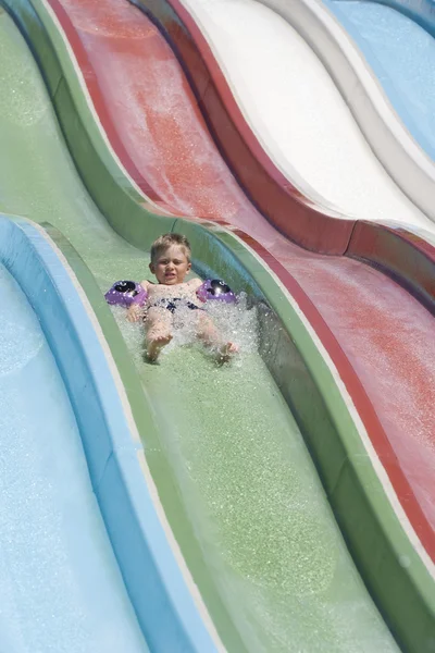 The boy on a waterslide. — Stock Photo, Image
