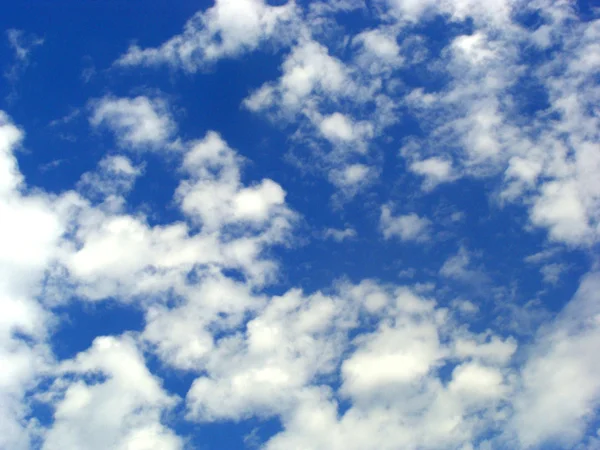 stock image White fluffy clouds in the blue sky