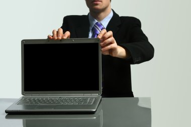 Business man holding laptop clipart