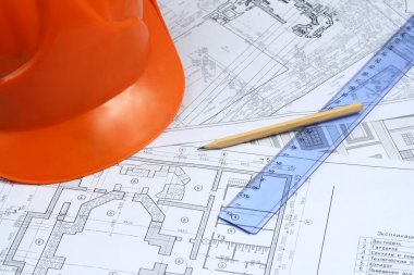 Building projects with architect drawing and protective tools clipart