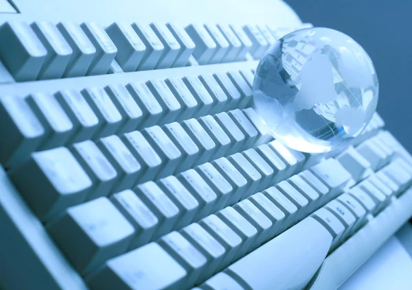 The glass globe on the keyboard — Stock Photo, Image