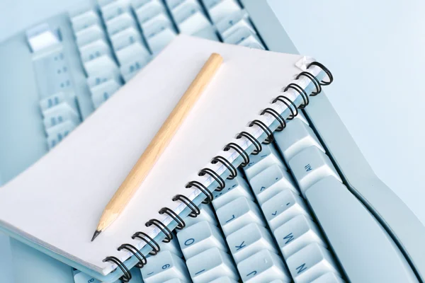 Notebook on the keyboard — Stock Photo, Image