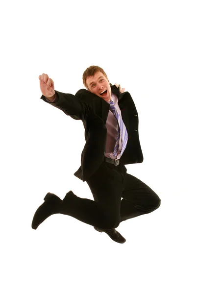 Springen jonge zakenman geïsoleerd op een witte achtergrond — Stockfoto