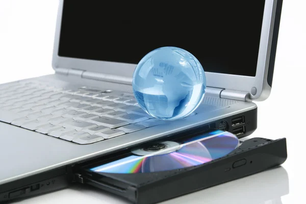 Glasses globe on laptop — Stock Photo, Image