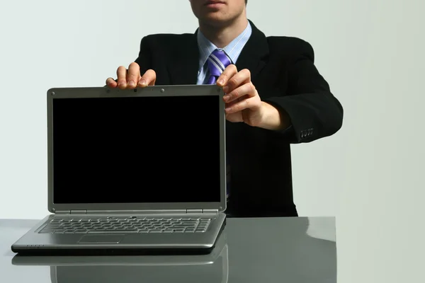Business man holding laptop — Stock Photo, Image