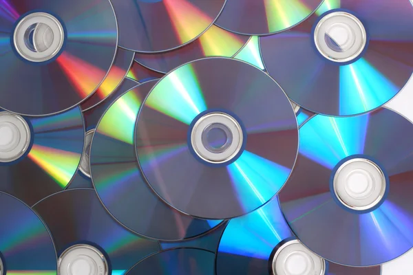 Bilgisayar dvd disklerinin birleşimini — Stok fotoğraf