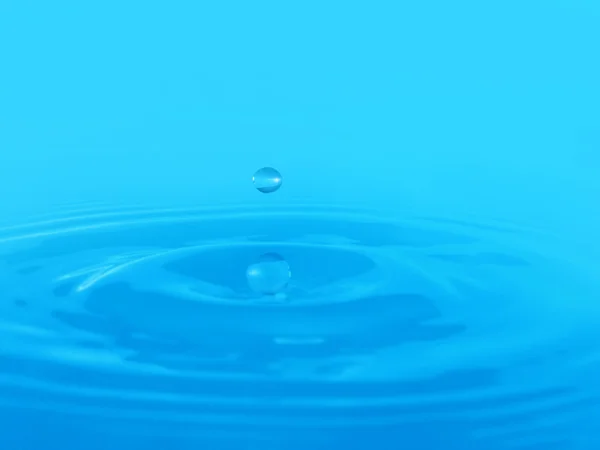 Искры голубой воды на голубом бэкграунде — стоковое фото