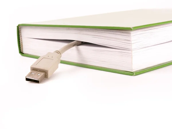 Buch und USB-Kabelfragment — Stockfoto