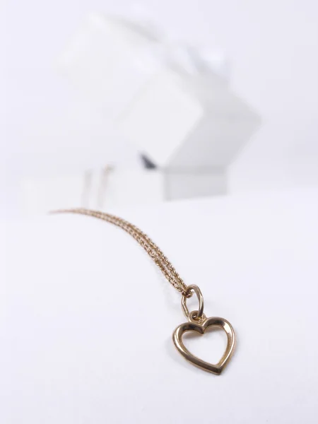 Golden necklace looks like heart — Stock Photo, Image
