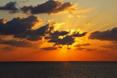 Sparkling sunset above sea