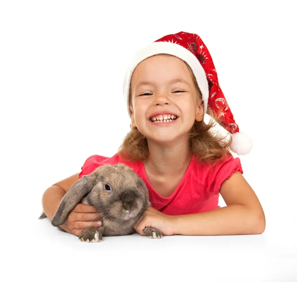 Dítě v klobouku nový rok s králíkem. — Stock fotografie