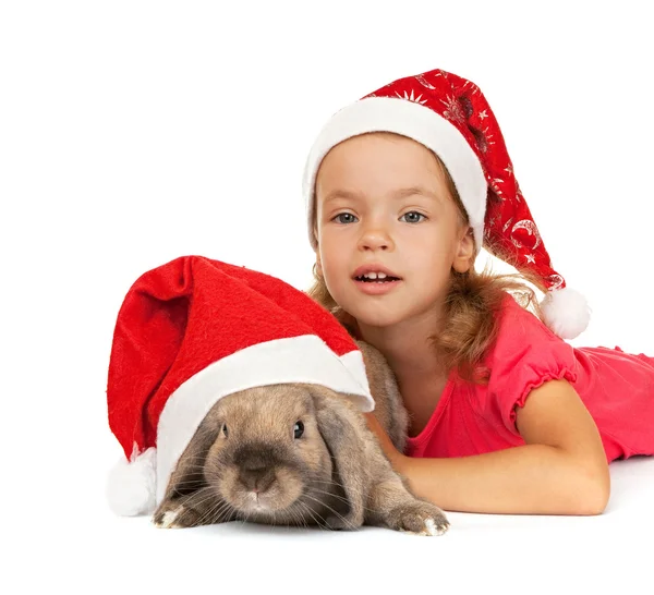 Criança no chapéu de Ano Novo com um coelho . — Fotografia de Stock