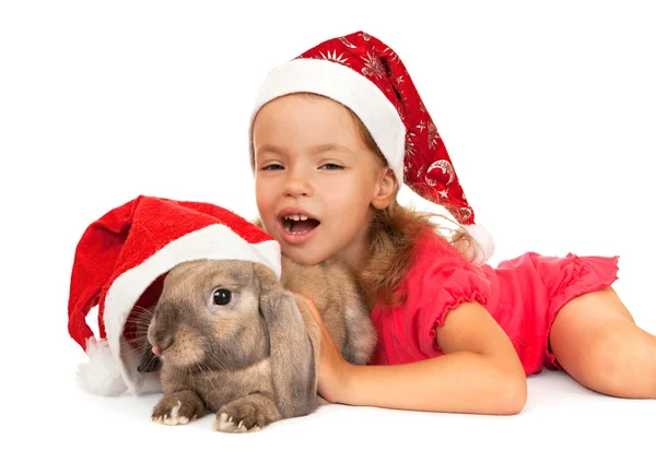 Ребенок в новогодней шляпе с кроликом . — стоковое фото