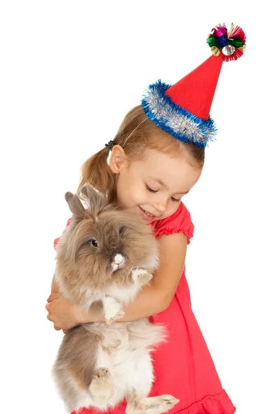 Child in the New Year hat with a rabbit. — Stock Photo, Image