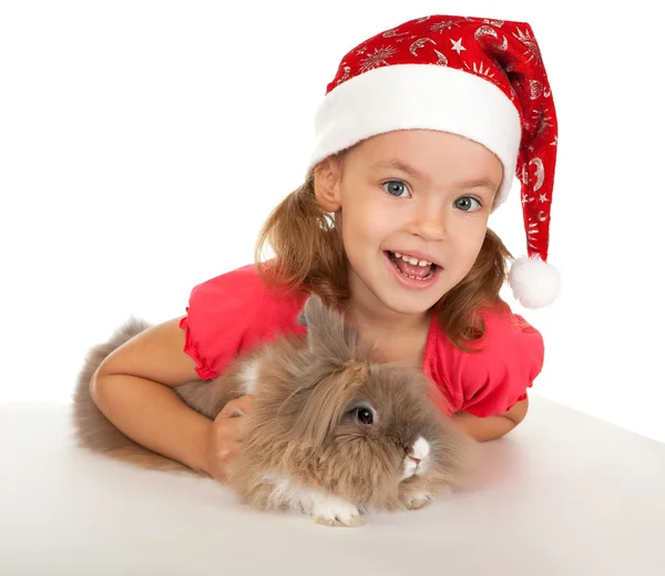 Bambino nel cappello di Capodanno con un coniglio . — Foto Stock