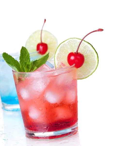 Two cocktails with lime slice and maraschino — Stock Photo, Image