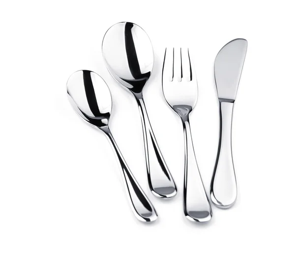Комплект столового серебра - вилка, нож и две ложки — стоковое фото