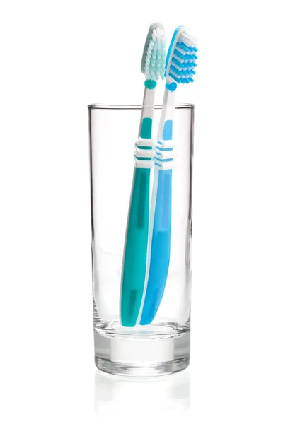 Two tooth brushes in glass — Stock Photo, Image