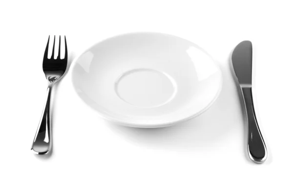 Gabel, Messer und leerer weißer Teller — Stockfoto