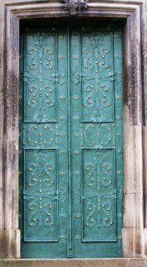 Old metal green door