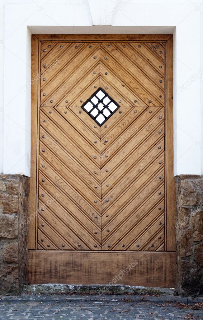 Ancient wooden door with the window