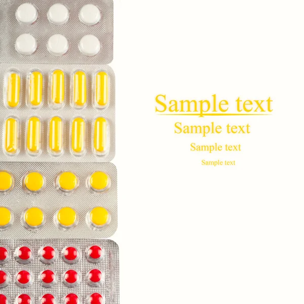 Embalagens de comprimidos isolados em fundo branco — Fotografia de Stock