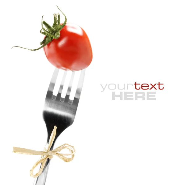 Tenedor con tomate fresco —  Fotos de Stock