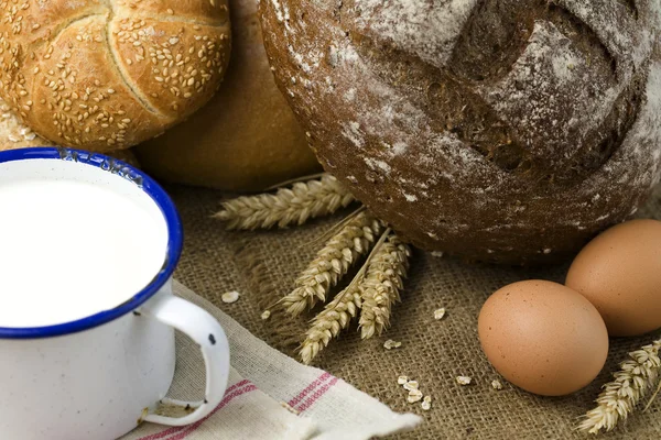 Wheat, bread, milk and eggs — Stock Photo, Image