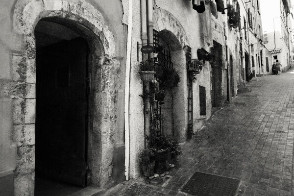 Old-fashioned street in Italy. Black in white image