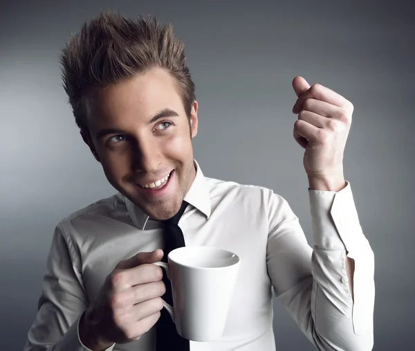 Young attractive macho drinking coffe — Stock Photo, Image
