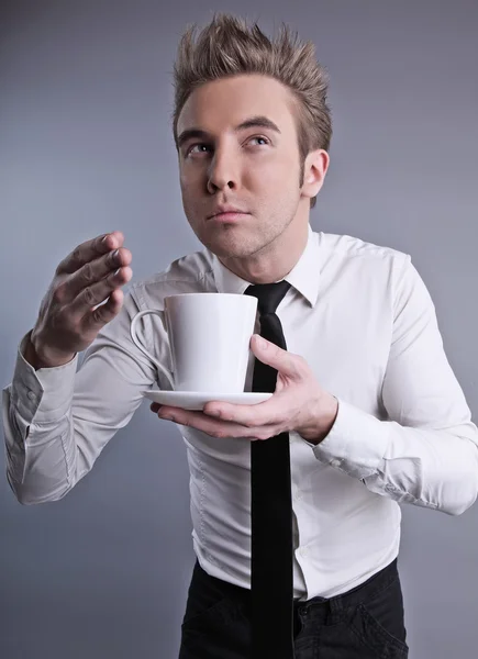 Young attractive macho drinking coffe — Stock Photo, Image